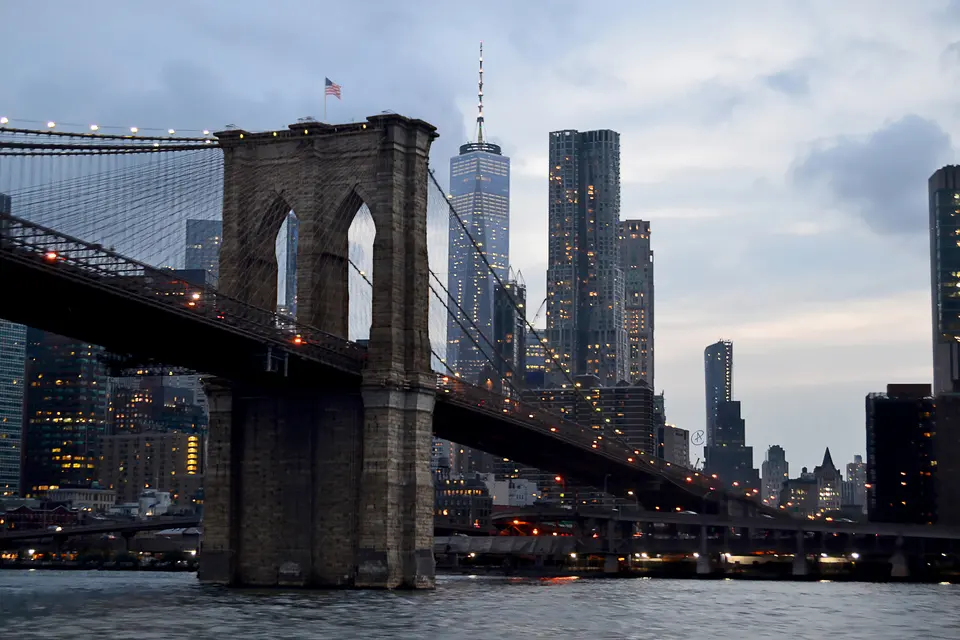 Brooklyn Bridge at dusk with the Lower Manhattan skyline behind it